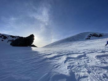 Scenic view of snowcapped mountain against sky