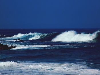 Waves splashing on rocks