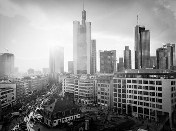 High angle view of buildings in city against sky