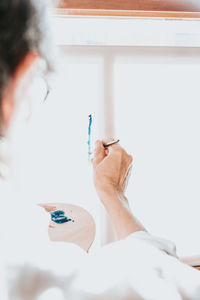 Side view of doctor examining patient in hospital