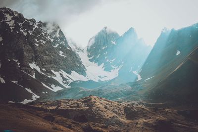 Scenic view of snowcapped mountains against sky