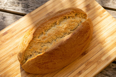 High angle view of bread on cutting board