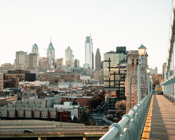 View of buildings in city against clear sky