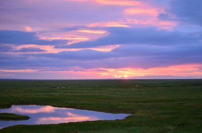 Scenic view of landscape against sky during sunset