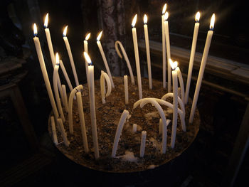 Close-up of candles burning