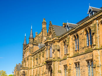 Low angle view of building against blue sky