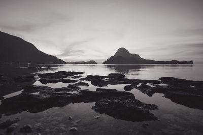Silhouetted mountains with rocks against sky