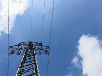 Low angle view of electricity pylon against sky