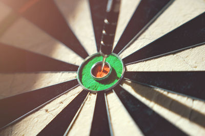 Close-up of dart on bulls-eye