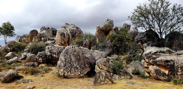 Low angle view of rock formation against sky