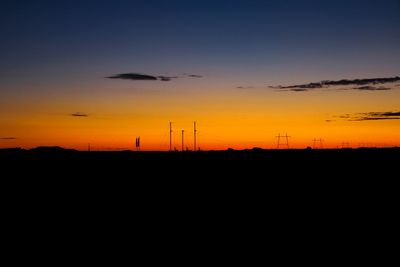 Silhouette landscape against sky during sunset