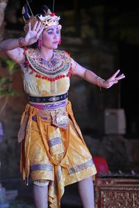 Woman in traditional clothing dancing