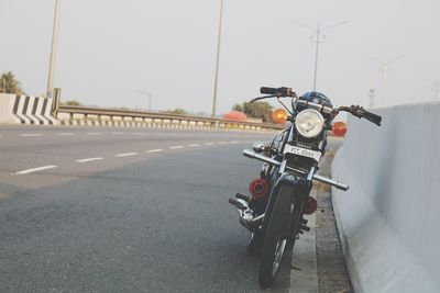 Close-up of motorcycle on road