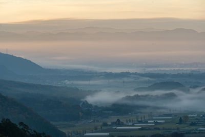 Scenic view of mountains against sky during sunset