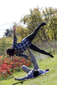 Woman excercising in field