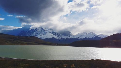 Scenic view of snowcapped mountains against sky