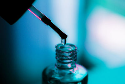 Close-up of bottle against blue background