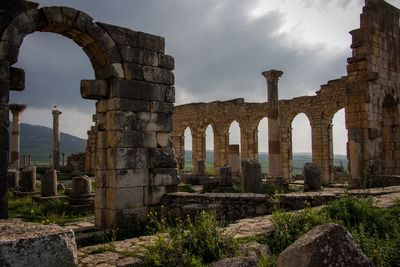 Old ruins of building against cloudy sky