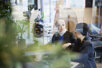 Businesswomen talking in cafe