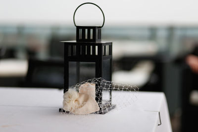 Close-up of glass container on table
