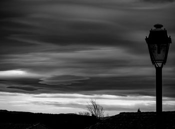 Low angle view of street light against sky at dusk