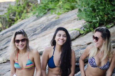 Smiling female friends at beach