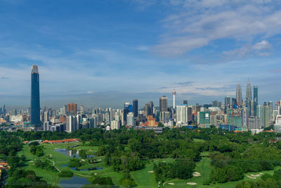 Modern buildings in city against sky