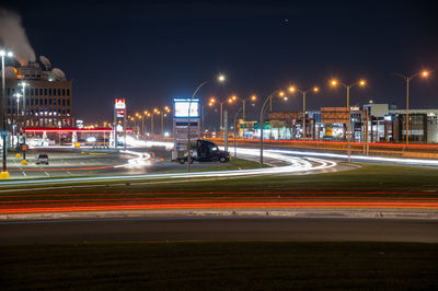 Light trails on city street at night