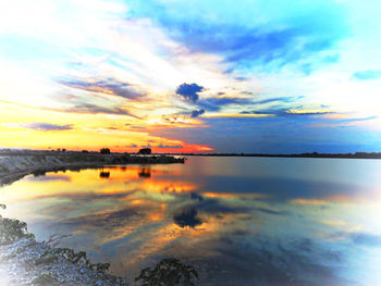 Scenic view of lake at sunset