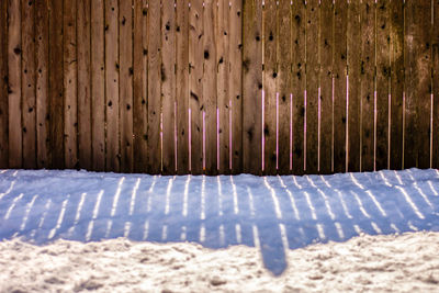 Snow on land against wall