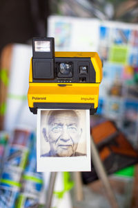 Close-up of yellow camera on mobile phone