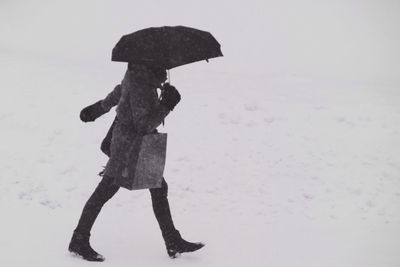 Woman standing on snow