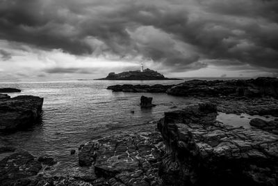 Scenic view of sea against cloudy sky