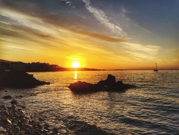 Scenic view of sea at sunset