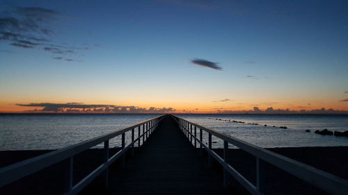 View of pier at sunset