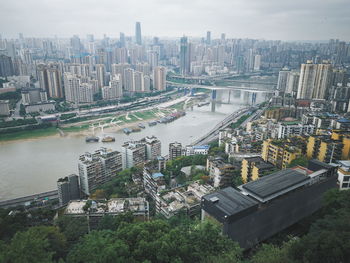 High angle view of river amidst buildings in city