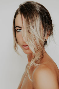 Close-up portrait of a serious young woman