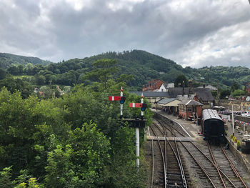 Train on railroad track against sky