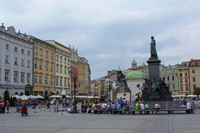 Group of people in front of buildings
