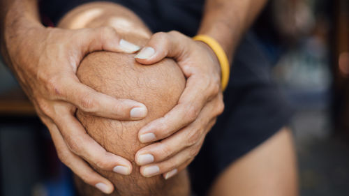 Close-up of woman holding hands