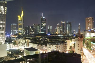 View of skyscrapers lit up at night