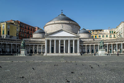 Piazza del plebiscito. a large public square in central naples, italy. summer with birds.