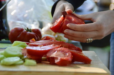 Cropped image of person preparing food