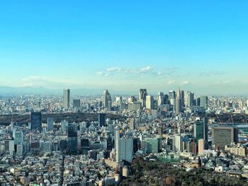 Aerial view of modern buildings in city against sky