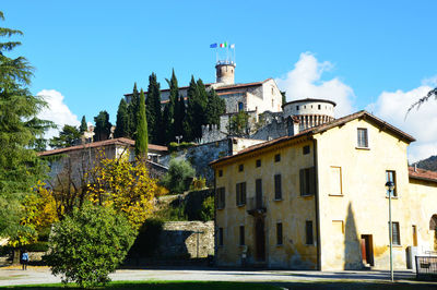 Low angle view of buildings in city against sky