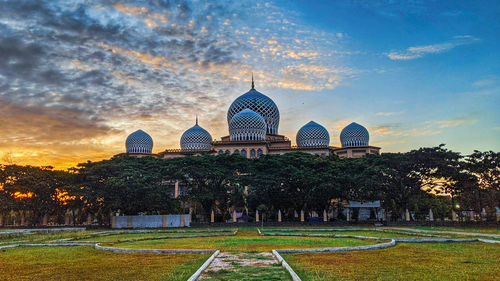 Building against sky during sunset