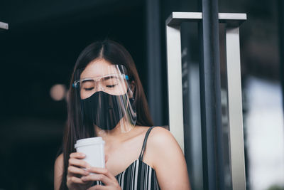 Portrait of a woman drinking water