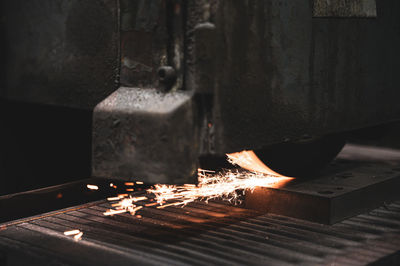 Close-up of fire burning on wood