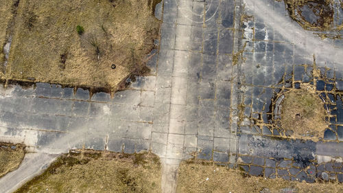 High angle view of abandoned puddle on road