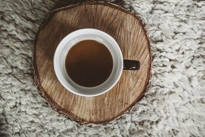 Directly above shot of coffee cup on table